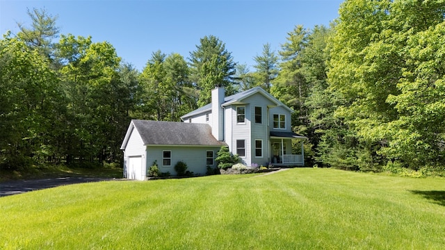 1531 Glasco Tpke, Saugerties, NY 12498 - view of home's exterior featuring a chimney, a garage, a yard, covered porch, and driveway