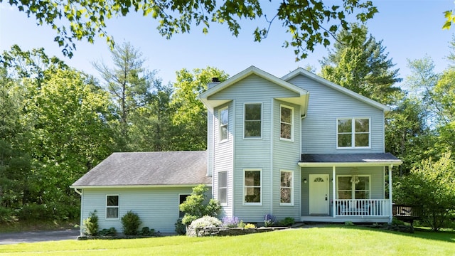 1531 Glasco Tpke, Saugerties, NY 12498 - view of front of house featuring covered porch, a front yard, a chimney, and a shingled roof