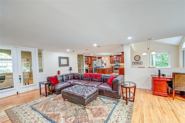 living room featuring light wood-type flooring, recessed lighting, and baseboards