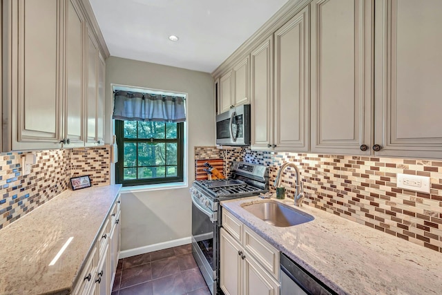 15 Manchester Rd Unit 2L, Eastchester, NY 10709 - kitchen with appliances with stainless steel finishes, a sink, cream cabinets, and backsplash
