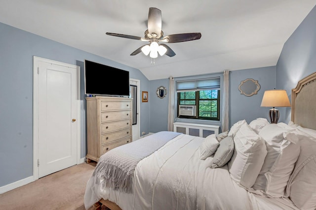 15 Manchester Rd Unit 2L, Eastchester, NY 10709 - bedroom with light colored carpet, baseboards, cooling unit, a ceiling fan, and vaulted ceiling