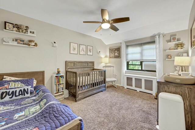 15 Manchester Rd Unit 2L, Eastchester, NY 10709 - bedroom with radiator heating unit, carpet floors, and a ceiling fan
