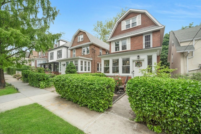 5749 Faraday Ave, Bronx, NY 10471 - view of front of property with a gambrel roof and brick siding