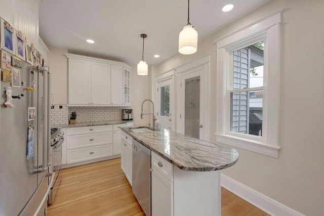 5749 Faraday Ave, Bronx, NY 10471 - kitchen featuring a sink, appliances with stainless steel finishes, backsplash, white cabinets, and recessed lighting