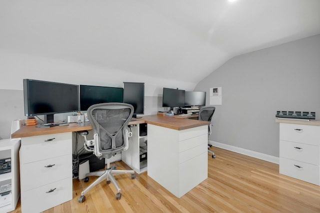 5749 Faraday Ave, Bronx, NY 10471 - home office with vaulted ceiling, light wood-type flooring, and baseboards