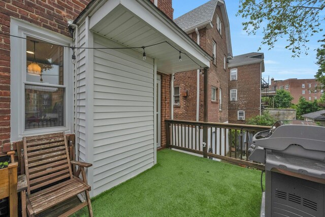 5749 Faraday Ave, Bronx, NY 10471 - view of side of property with brick siding, a chimney, and a yard