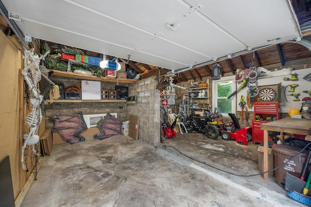 5749 Faraday Ave, Bronx, NY 10471 - garage featuring a workshop area and a garage door opener