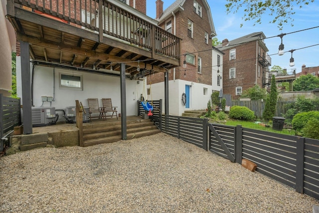 5749 Faraday Ave, Bronx, NY 10471 - back of property featuring a deck, cooling unit, and brick siding