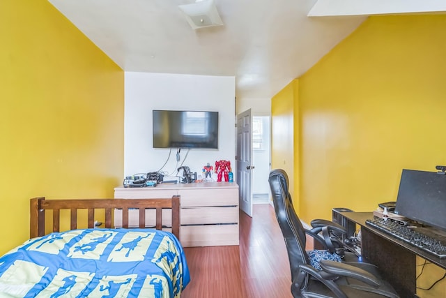 253 N 3rd Ave, Bay Shore, NY 11706 - bedroom with a desk and dark wood-style floors