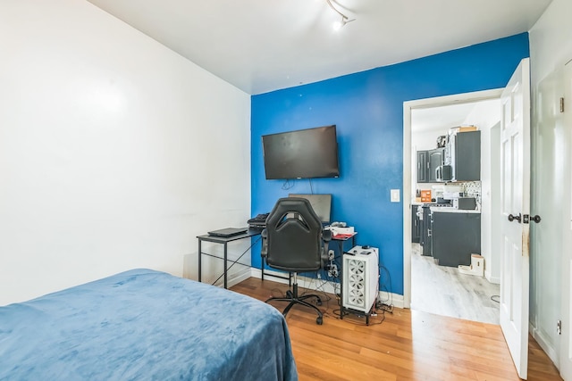 253 N 3rd Ave, Bay Shore, NY 11706 - bedroom with wood finished floors and baseboards