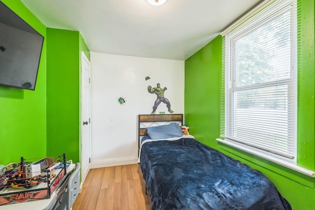 253 N 3rd Ave, Bay Shore, NY 11706 - bedroom with light wood-style floors and baseboards
