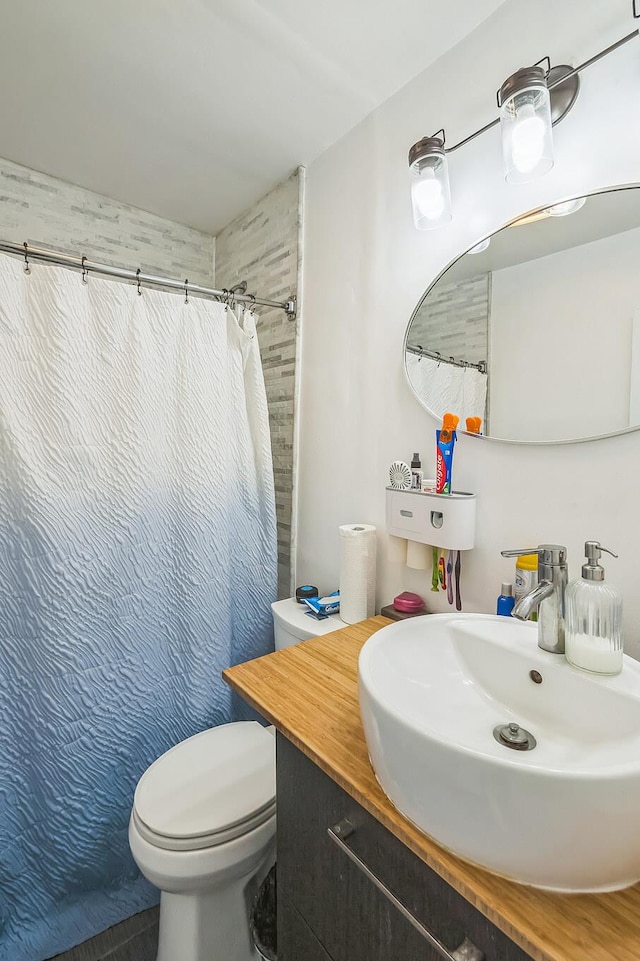 253 N 3rd Ave, Bay Shore, NY 11706 - bathroom featuring a sink, toilet, and a shower with shower curtain