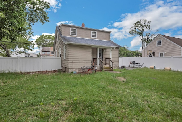 253 N 3rd Ave, Bay Shore, NY 11706 - back of house featuring a chimney and roof with shingles