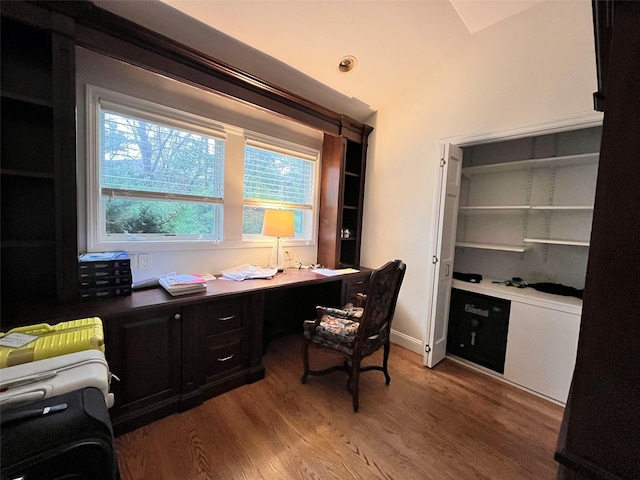 office with light wood finished floors, lofted ceiling, and baseboards