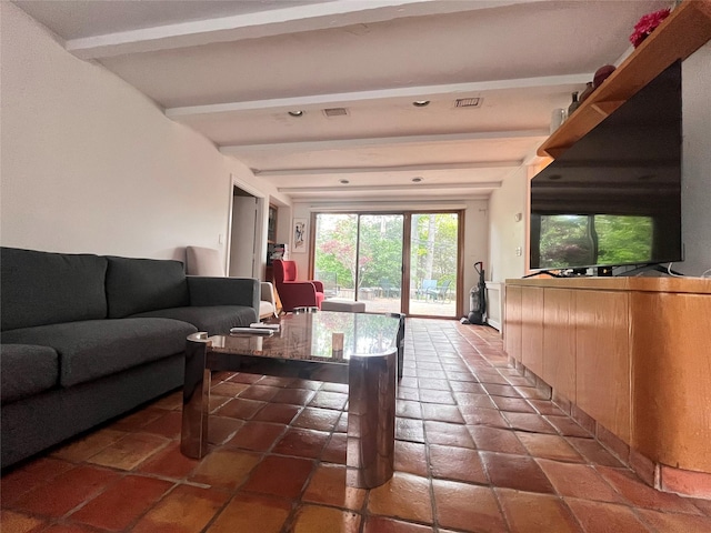 living area featuring beam ceiling