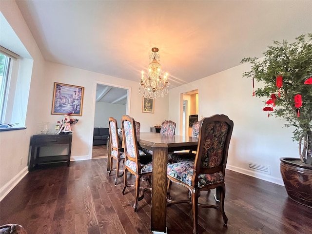 dining space with a chandelier, dark wood-style floors, and baseboards