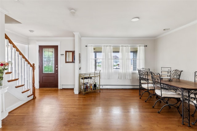 160 Sequams Ln W, West Islip, NY 11795 - foyer featuring wood finished floors, stairway, crown molding, and a baseboard radiator