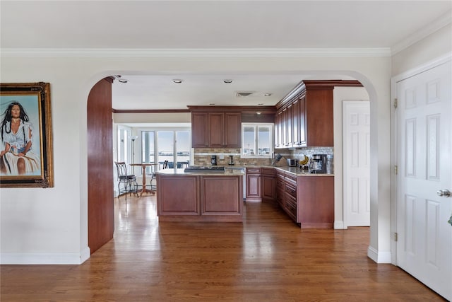 160 Sequams Ln W, West Islip, NY 11795 - kitchen featuring arched walkways, dark wood-style floors, baseboards, and ornamental molding