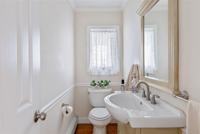 160 Sequams Ln W, West Islip, NY 11795 - bathroom with toilet, a baseboard heating unit, and crown molding