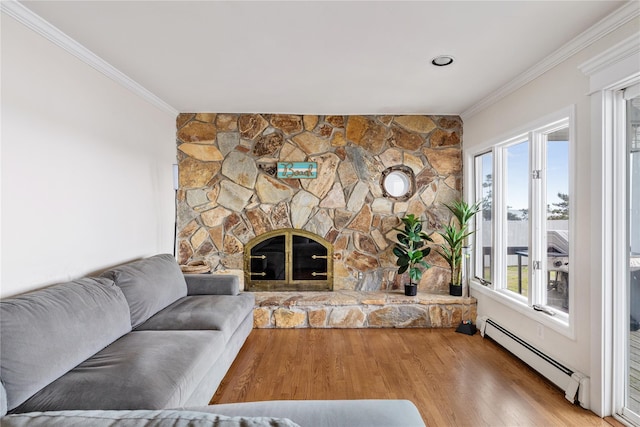 160 Sequams Ln W, West Islip, NY 11795 - living area with baseboard heating, ornamental molding, wood finished floors, and a stone fireplace