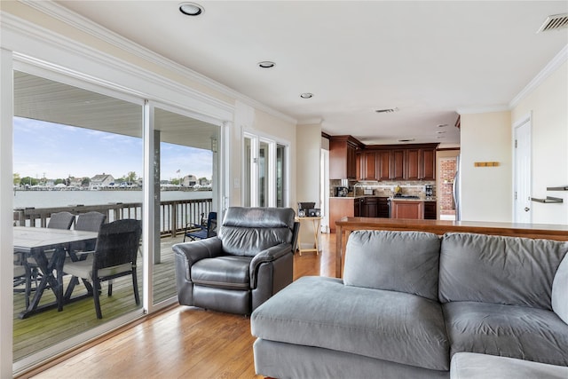 160 Sequams Ln W, West Islip, NY 11795 - living area featuring ornamental molding, light wood-style flooring, recessed lighting, and a water view