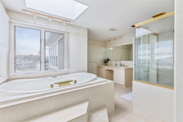160 Sequams Ln W, West Islip, NY 11795 - full bathroom with a skylight, tile patterned flooring, a garden tub, vanity, and tiled shower