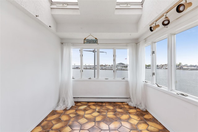 160 Sequams Ln W, West Islip, NY 11795 - unfurnished sunroom with baseboard heating, plenty of natural light, and a water view