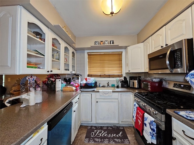 3 Allan Park Mews, Middletown, NY 10940 - kitchen featuring appliances with stainless steel finishes, white cabinetry, a sink, glass insert cabinets, and dark countertops