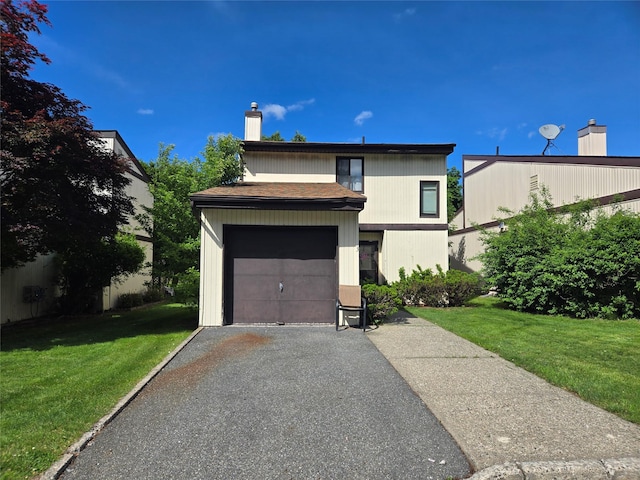 3 Allan Park Mews, Middletown, NY 10940 - view of front of home with a chimney, a front lawn, and asphalt driveway