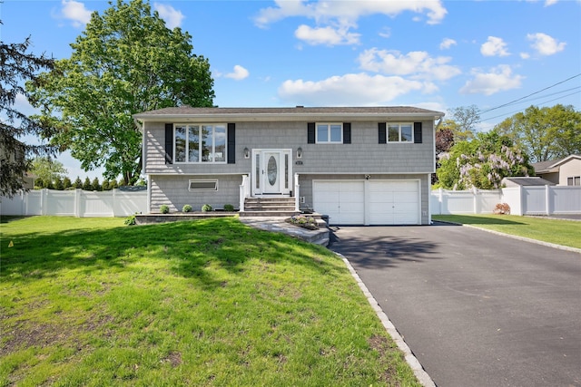 bi-level home featuring driveway and a garage