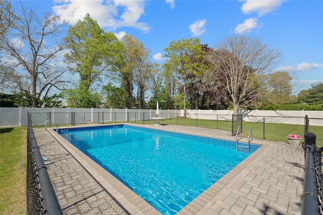 view of swimming pool featuring a patio area