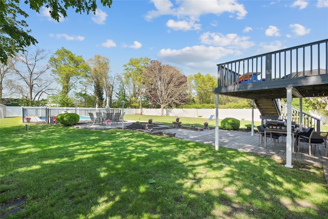 view of yard with stairs, a patio, and a wooden deck