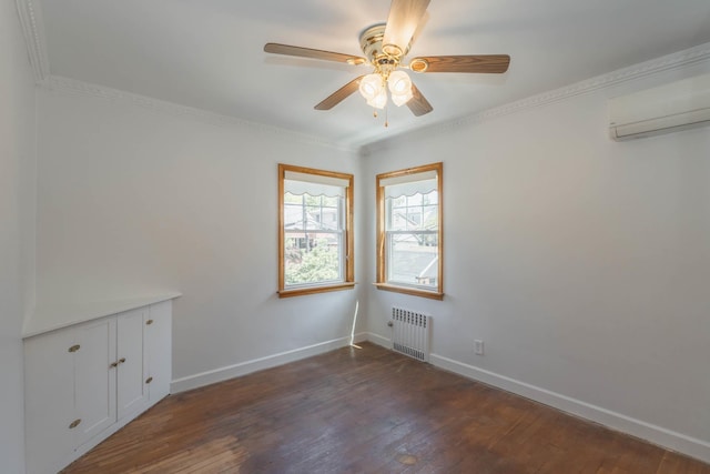 unfurnished room featuring radiator, a wall mounted AC, dark wood finished floors, ceiling fan, and baseboards