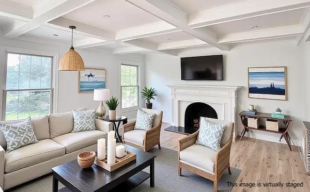2850 Reeve Rd, Mattituck, NY 11952 - living room featuring coffered ceiling, beamed ceiling, light wood-type flooring, a fireplace with raised hearth, and baseboards