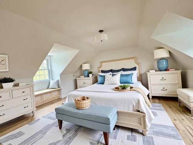 2850 Reeve Rd, Mattituck, NY 11952 - bedroom featuring lofted ceiling and wood finished floors