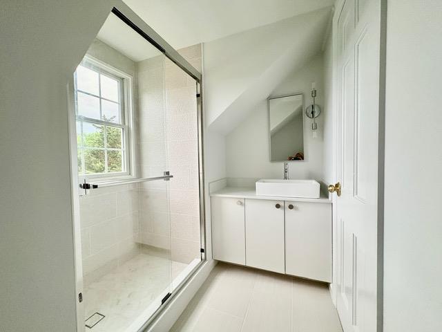 2850 Reeve Rd, Mattituck, NY 11952 - bathroom featuring a stall shower, vanity, and tile patterned flooring