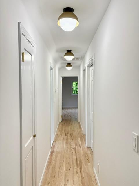 2850 Reeve Rd, Mattituck, NY 11952 - hall with light wood-type flooring and baseboards