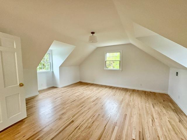 2850 Reeve Rd, Mattituck, NY 11952 - bonus room with wood finished floors, plenty of natural light, vaulted ceiling, and baseboards