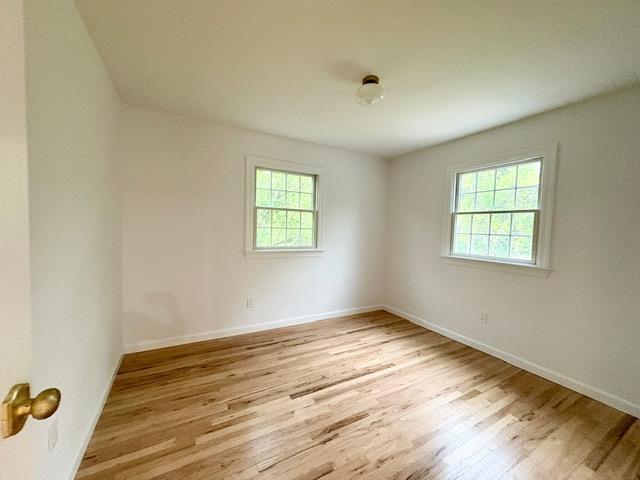 2850 Reeve Rd, Mattituck, NY 11952 - unfurnished room featuring light wood-type flooring and baseboards