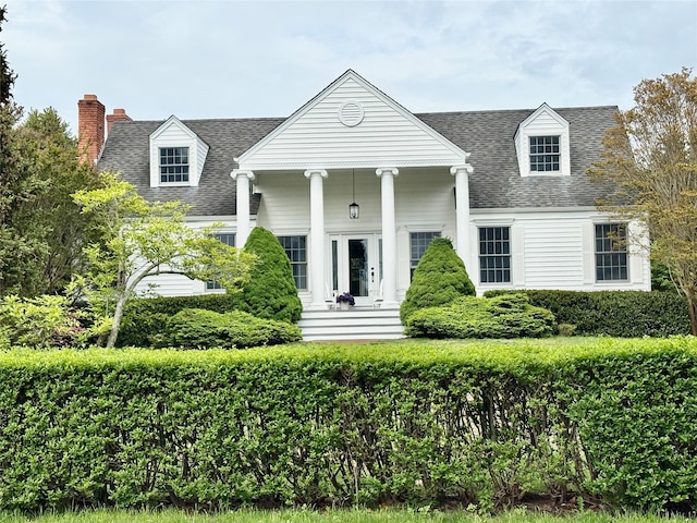 2850 Reeve Rd, Mattituck, NY 11952 - neoclassical / greek revival house featuring roof with shingles and a chimney