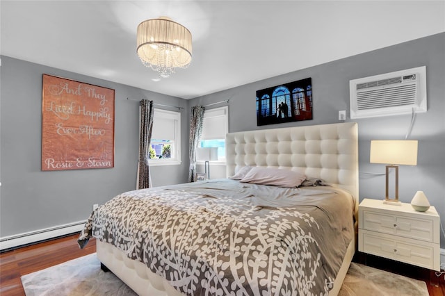 bedroom featuring wood finished floors, a wall mounted air conditioner, a chandelier, and a baseboard radiator