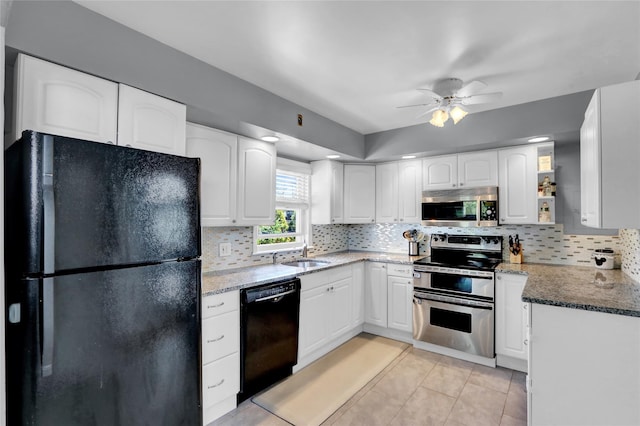 kitchen with black appliances, a ceiling fan, decorative backsplash, white cabinetry, and light tile patterned flooring