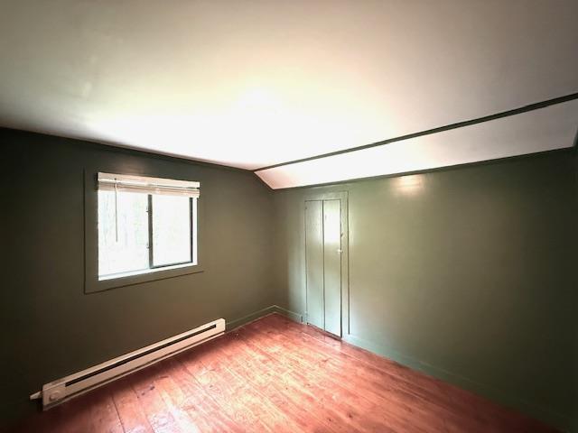 38 Eldred Yulan Rd, Eldred, NY 12732 - additional living space featuring a baseboard radiator, vaulted ceiling, wood finished floors, and baseboards