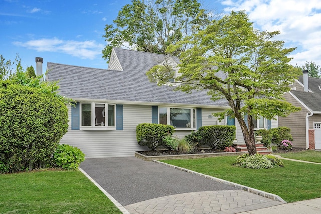 27 Amby Ave, Plainview, NY 11803 - view of front of home featuring a front lawn and a shingled roof