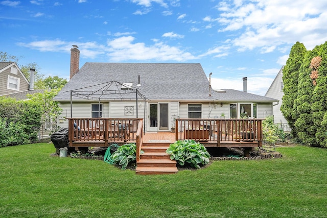 27 Amby Ave, Plainview, NY 11803 - back of house with a yard, a wooden deck, and roof with shingles
