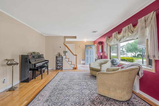 27 Amby Ave, Plainview, NY 11803 - living area with stairs, wood finished floors, baseboards, and ornamental molding