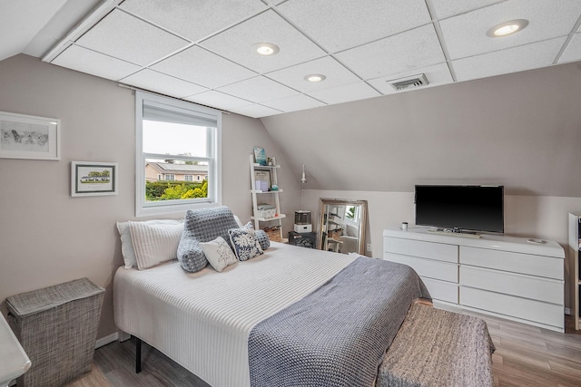 27 Amby Ave, Plainview, NY 11803 - bedroom featuring wood finished floors, lofted ceiling, recessed lighting, and baseboards