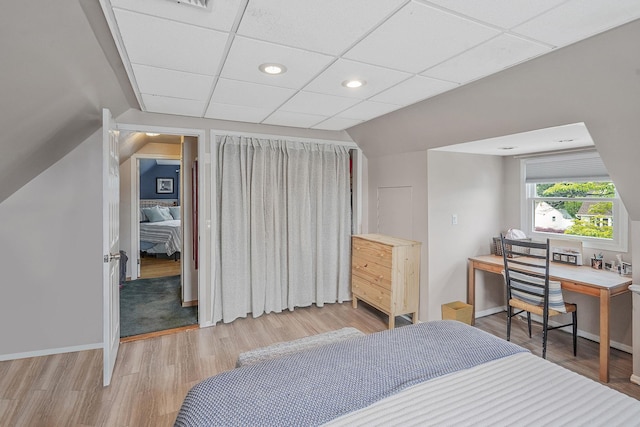 27 Amby Ave, Plainview, NY 11803 - bedroom with wood finished floors, a desk, recessed lighting, a paneled ceiling, and baseboards