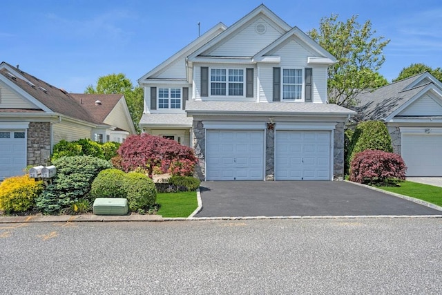 30 Julia Cir, Middle Island, NY 11953 - traditional-style house featuring stone siding, asphalt driveway, and an attached garage