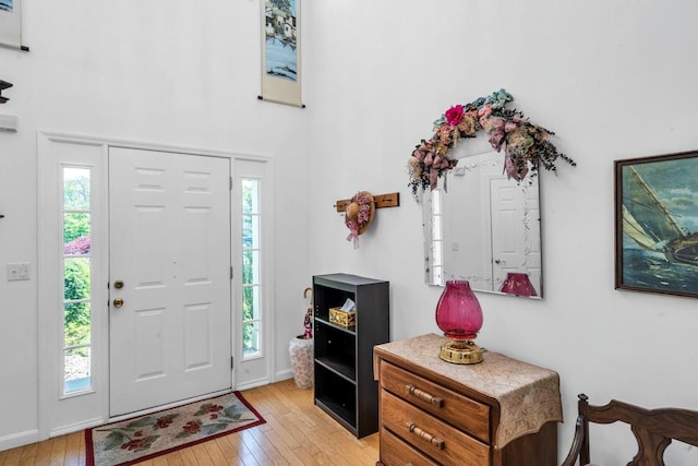 30 Julia Cir, Middle Island, NY 11953 - foyer entrance with light wood-type flooring and a high ceiling